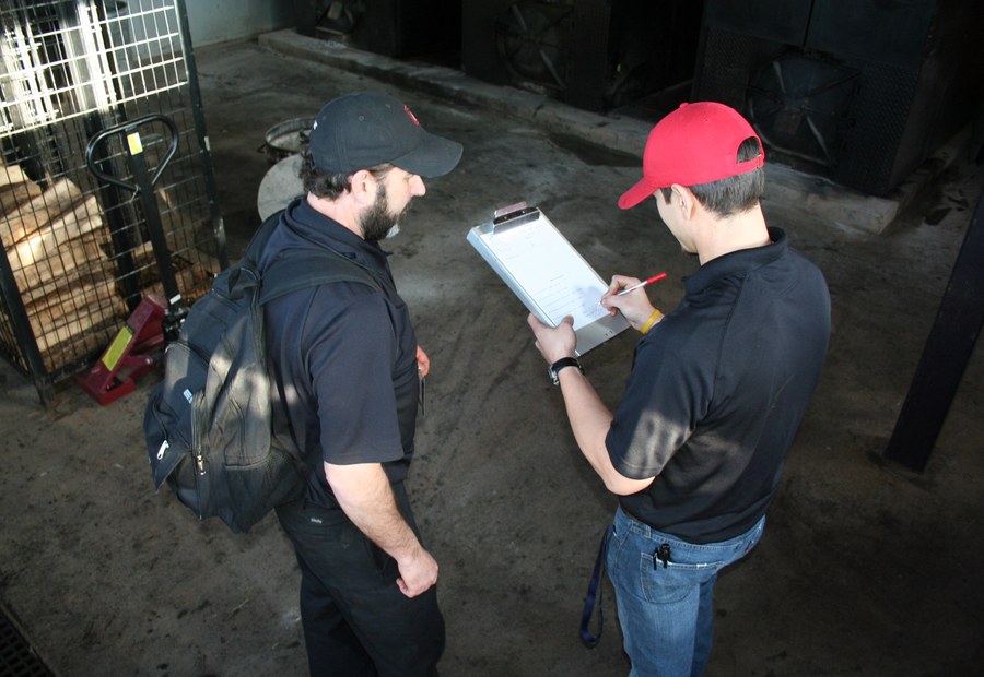 DRIPLOC service team documenting rooftop conditions